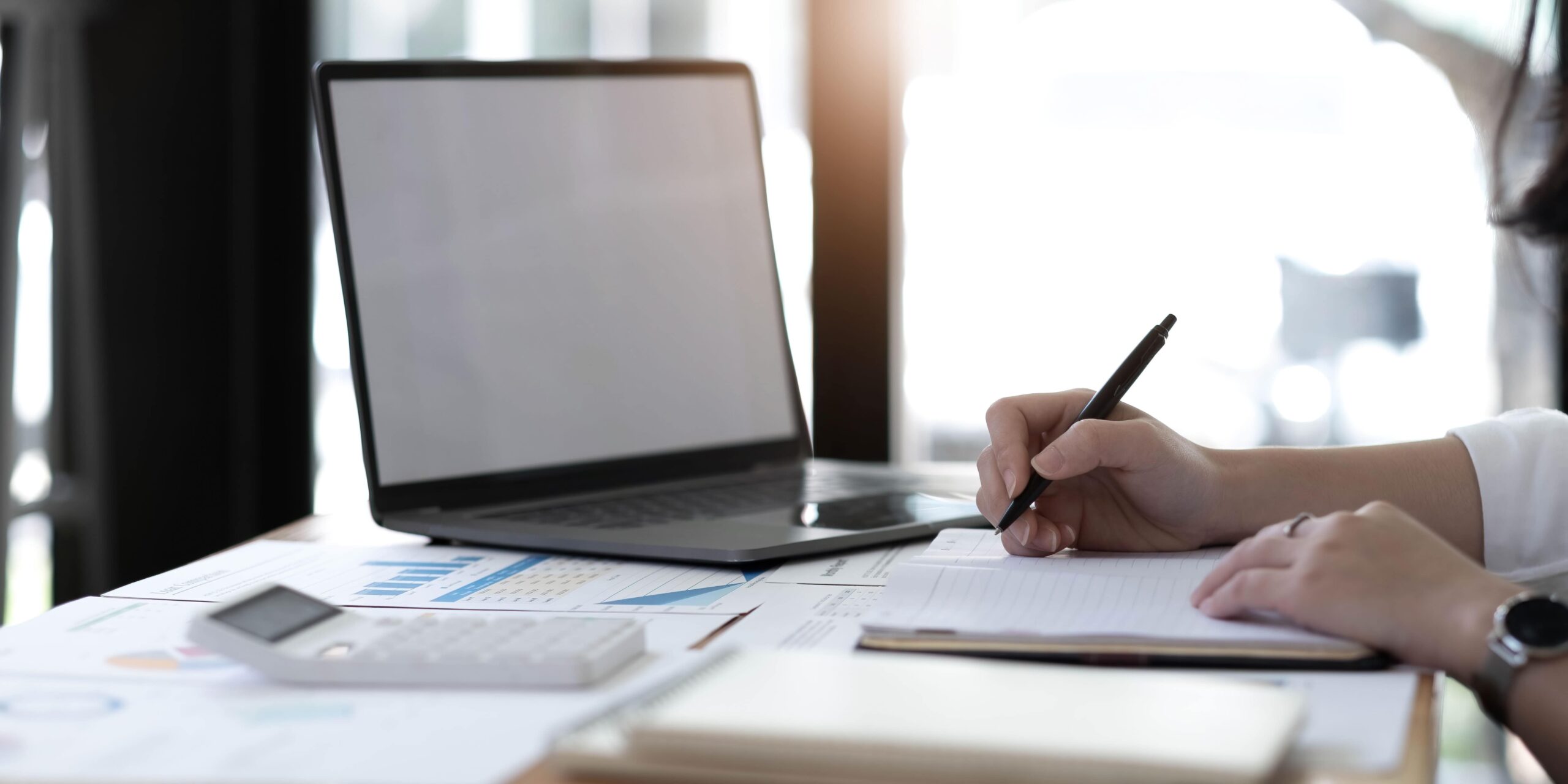 young businesswoman sitting at desk